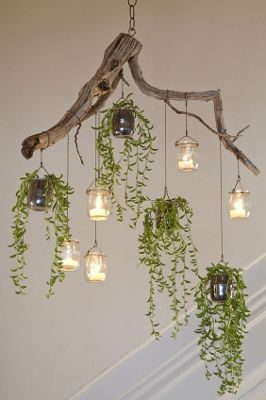 DIY Branches Chandelier with mason jars, candles, and handing plants