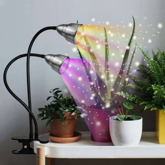 Dual head clip-on grow light on gooseneck attached to a shelf with plants