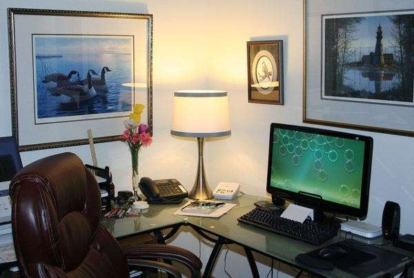 Home office computer table with a traditional table lamp