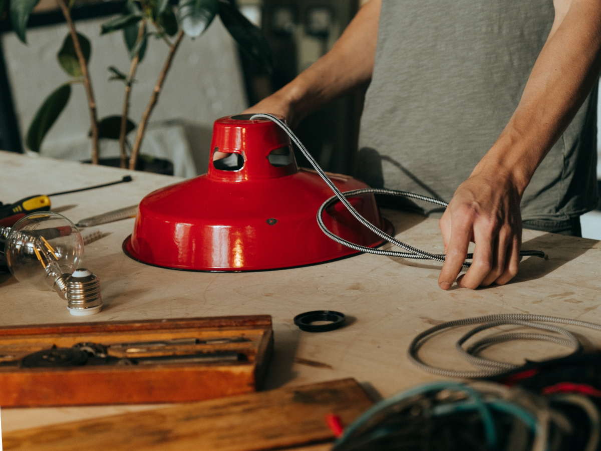 Taken apart desk lamp and light bulb on a workbench