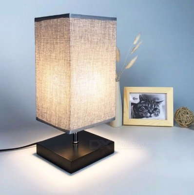 A lamp with a square shaped lamp shade